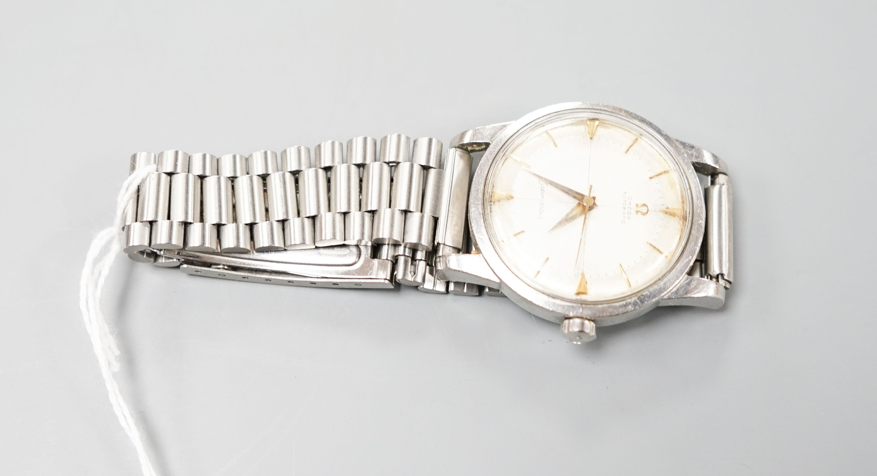A gentleman's late 1950's stainless steel Omega Seamaster automatic wrist watch, on associated steel bracelet, movement c.501, no box or papers, cased diameter 36mm.